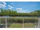 Scenic balcony view overlooking lush greenery, clear waters, and a bright, sunny sky at 3230 Mangrove Point Dr, Ruskin, FL 33570