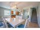 Open floor plan featuring dining area, kitchen, staircase, and comfortable seating at 3230 Mangrove Point Dr, Ruskin, FL 33570