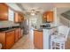 Inviting kitchen featuring wood cabinets, granite countertops and stainless steel appliances at 3230 Mangrove Point Dr, Ruskin, FL 33570