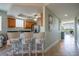 Eat-in kitchen featuring bar seating, wood cabinetry, and stainless steel appliances at 3230 Mangrove Point Dr, Ruskin, FL 33570