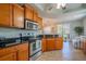 Modern kitchen with stainless steel appliances, granite countertops, and ample cabinet space at 3230 Mangrove Point Dr, Ruskin, FL 33570