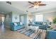 Cozy living room with comfortable sofas, tile floors, and large windows offering views of outdoors at 3230 Mangrove Point Dr, Ruskin, FL 33570