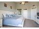 Bright main bedroom featuring light blue bedding and a white wood bed frame at 3230 Mangrove Point Dr, Ruskin, FL 33570
