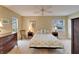 Neutral bedroom with carpet, ceiling fan, and standard closet at 330 Gloucester Blvd, Sun City Center, FL 33573