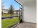 Screened-in porch provides a tranquil view of the lush green space, enhancing outdoor living at 3461 Timber Crossing Ave, Brandon, FL 33511