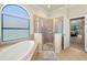 Bright bathroom features a soaking tub and glass-enclosed shower at 351 Hope Bay Loop, Apollo Beach, FL 33572