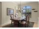 Elegant dining room with a large window, chandelier and classic wood furniture at 351 Hope Bay Loop, Apollo Beach, FL 33572