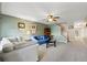 Cozy living room with neutral carpet, soft lighting, and comfortable furnishings at 3848 Mariner Dr, St Petersburg, FL 33705