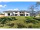 Expansive backyard featuring a screened-in pool and patio area, perfect for outdoor entertaining at 4520 Pine Hollow Dr, Tampa, FL 33624
