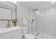 Bathroom with modern sink and vanity, rainfall shower, and elegant tiling in shower area at 4520 Pine Hollow Dr, Tampa, FL 33624