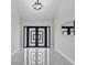Bright foyer features a modern front door design and elegant marble flooring at 4520 Pine Hollow Dr, Tampa, FL 33624