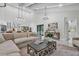 Open-concept living area features a modern kitchen, living room and access to the pool at 4520 Pine Hollow Dr, Tampa, FL 33624