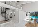 Open living area with spiral staircase and direct access to the pool at 4520 Pine Hollow Dr, Tampa, FL 33624