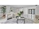 Open-concept living room with elegant furniture, marble floors and stylish decor at 4520 Pine Hollow Dr, Tampa, FL 33624