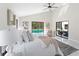Luxurious main bedroom with a king-size bed and a view of the pool at 4520 Pine Hollow Dr, Tampa, FL 33624