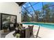 Inviting screened pool area with comfortable outdoor seating, perfect for entertaining and relaxation at 4520 Pine Hollow Dr, Tampa, FL 33624