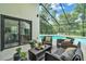 Relaxing screened-in pool area with comfortable seating, perfect for enjoying the outdoors at 4520 Pine Hollow Dr, Tampa, FL 33624