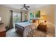 Cozy bedroom with a queen-sized bed, soft lighting, and a window view at 4908 Oakshire Dr, Tampa, FL 33625