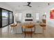 Bright and airy living room with modern fireplace and large glass doors to outdoor space at 521 Baywood S Dr, Dunedin, FL 34698