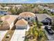 Aerial view of a beautiful home with a two car garage and a mature landscaped yard at 5337 Treig Ln, Wesley Chapel, FL 33545