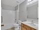Bathroom featuring vanity, shower-tub combo and tiled floors at 5337 Treig Ln, Wesley Chapel, FL 33545