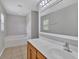 Bathroom with vanity, tile floor, and soaking tub at 5337 Treig Ln, Wesley Chapel, FL 33545