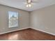 Bedroom with ceiling fan and a large window at 5337 Treig Ln, Wesley Chapel, FL 33545