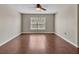 Bright bedroom featuring hardwood floors, neutral colors, and natural light at 5337 Treig Ln, Wesley Chapel, FL 33545