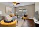 Cozy living room with stylish furniture, a large window, and modern decor at 5337 Treig Ln, Wesley Chapel, FL 33545