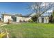 A backyard featuring a wood patio and a covered seating area perfect for relaxing outdoors at 5440 Quist Dr, Port Richey, FL 34668