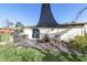The backyard features a wood patio and a covered seating area perfect for relaxing outdoors at 5440 Quist Dr, Port Richey, FL 34668