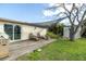 A backyard featuring a wood patio and a covered seating area perfect for relaxing outdoors at 5440 Quist Dr, Port Richey, FL 34668