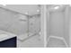 Modern bathroom featuring a glass walk-in shower at 5440 Quist Dr, Port Richey, FL 34668