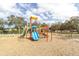 Colorful playground equipment including slides, ladders, and swings for outdoor fun and recreation at 5440 Quist Dr, Port Richey, FL 34668