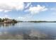 Beautiful water view with homes visible in the distance, creating a peaceful setting at 5440 Quist Dr, Port Richey, FL 34668