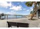 Picturesque waterfront view with scenic bench seating and serene water views at 5440 Quist Dr, Port Richey, FL 34668