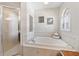 Bright bathroom featuring a separate shower and soaking tub at 5815 Dory Way, Tampa, FL 33615