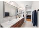 Bathroom features double sinks, a large mirror, and natural light at 5815 Dory Way, Tampa, FL 33615