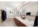 Lovely bathroom with double sinks, bathtub, and large mirror at 5815 Dory Way, Tampa, FL 33615