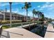 Waterfront home featuring a private boat dock with lift along the canal, ideal for boating enthusiasts at 5815 Dory Way, Tampa, FL 33615