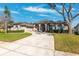 Beautiful home featuring well-maintained landscaping, a spacious driveway, and an attached two-car garage at 5815 Dory Way, Tampa, FL 33615