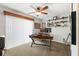 Spacious home office with a large desk, comfortable chair, and natural light at 5815 Dory Way, Tampa, FL 33615