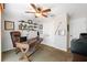 Inviting home office with a leather chair, shelving, and ceiling fan at 5815 Dory Way, Tampa, FL 33615