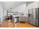 Well-lit kitchen featuring stainless steel appliances and ample counter space at 5815 Dory Way, Tampa, FL 33615