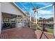 The screened lanai provides a smooth transition to the pool, patio, canal, and other exterior features of this home at 5815 Dory Way, Tampa, FL 33615