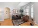 Cozy living room with hardwood floors, arched windows, comfortable seating and lots of natural light at 5815 Dory Way, Tampa, FL 33615