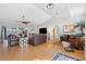 Spacious living room featuring hardwood floors, a fireplace, high ceilings, and lots of natural light at 5815 Dory Way, Tampa, FL 33615