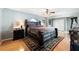 Spacious main bedroom with a large bed, ceiling fan, and lots of space at 5815 Dory Way, Tampa, FL 33615