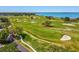 Scenic golf course overlooking the ocean, with meticulously maintained greens, challenging sand traps, and mature trees at 605 Gardenia St, Belleair, FL 33756