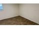 A simple bedroom with hardwood floors and a window at 6308 Newtown Cir # 8A3, Tampa, FL 33615